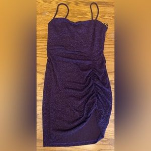 This is a purple homecoming dress, sparkly, with a high slit